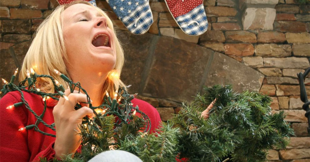 A woman having a meltdown while she gets ready for Christmas