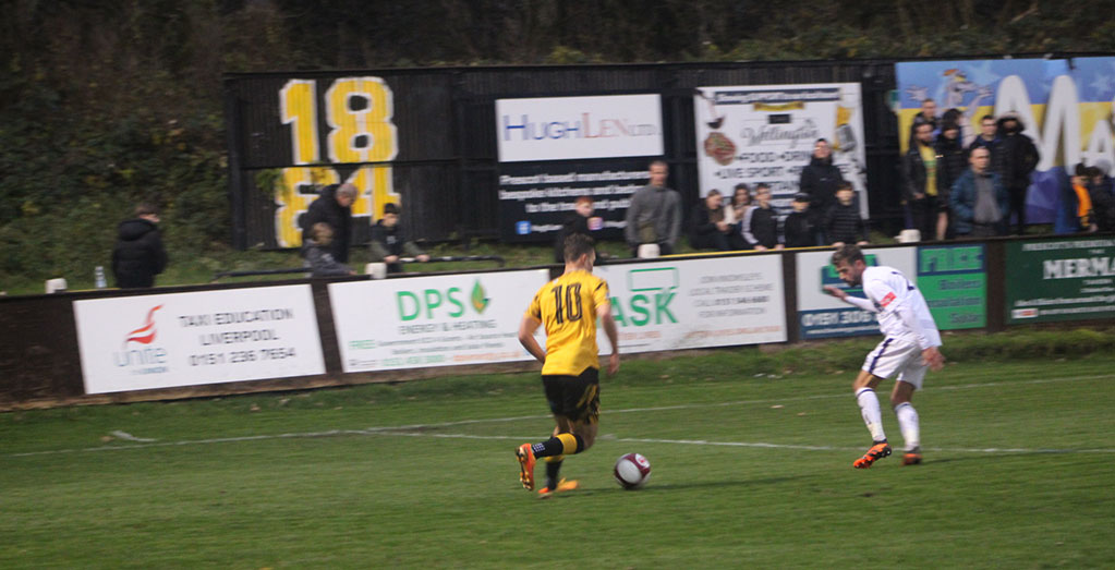 Kyle Sambor in possession during Prescot Cables 5-1 Trafford, 28/11/23. Photo by Lilly Coates. Reproduced with permission.