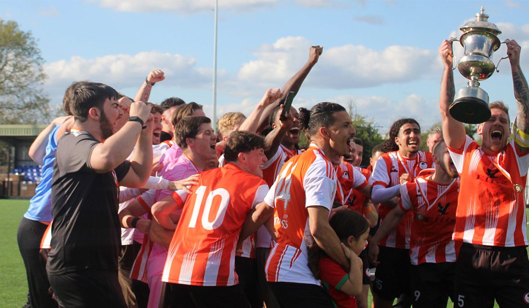 Ashford Town (Middlesex) lift their championship trophy, 18/04/26. Photo by Lillian Coates